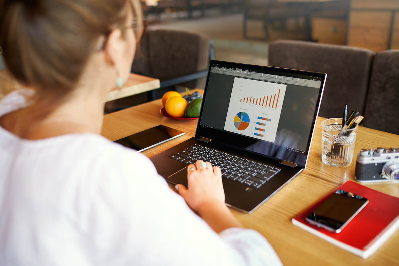 Woman looking for nonprofit crm software on her laptop