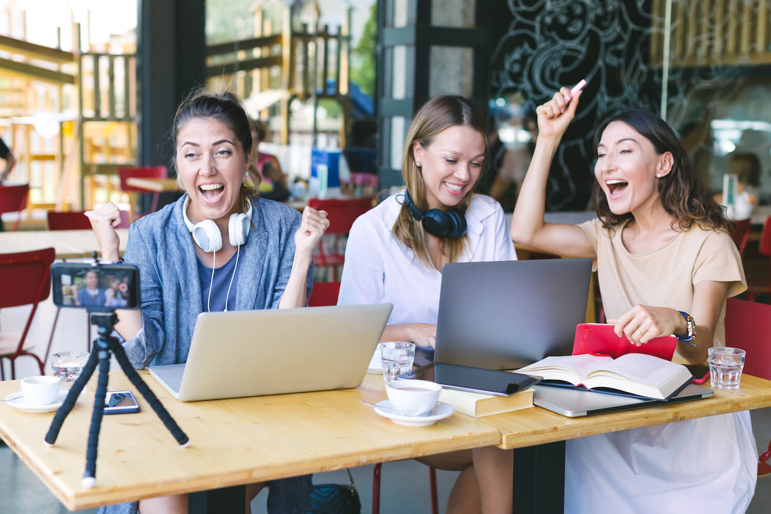 Three women recording a fundraising video