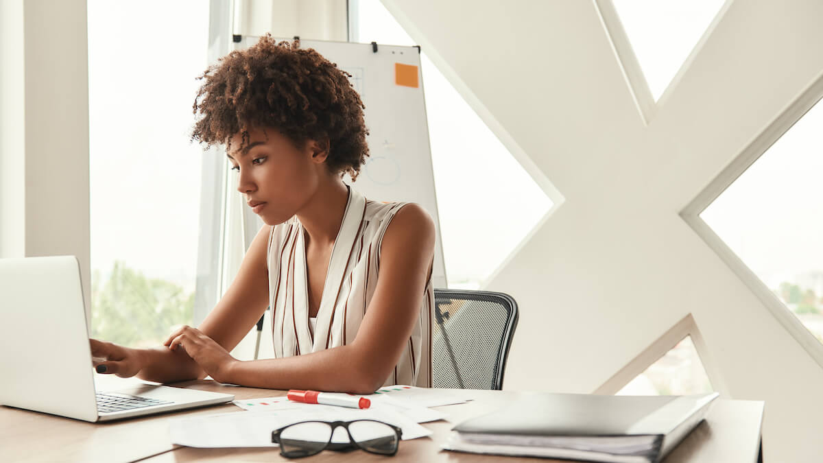 Young woman writing a gran proposal for her nonprofit