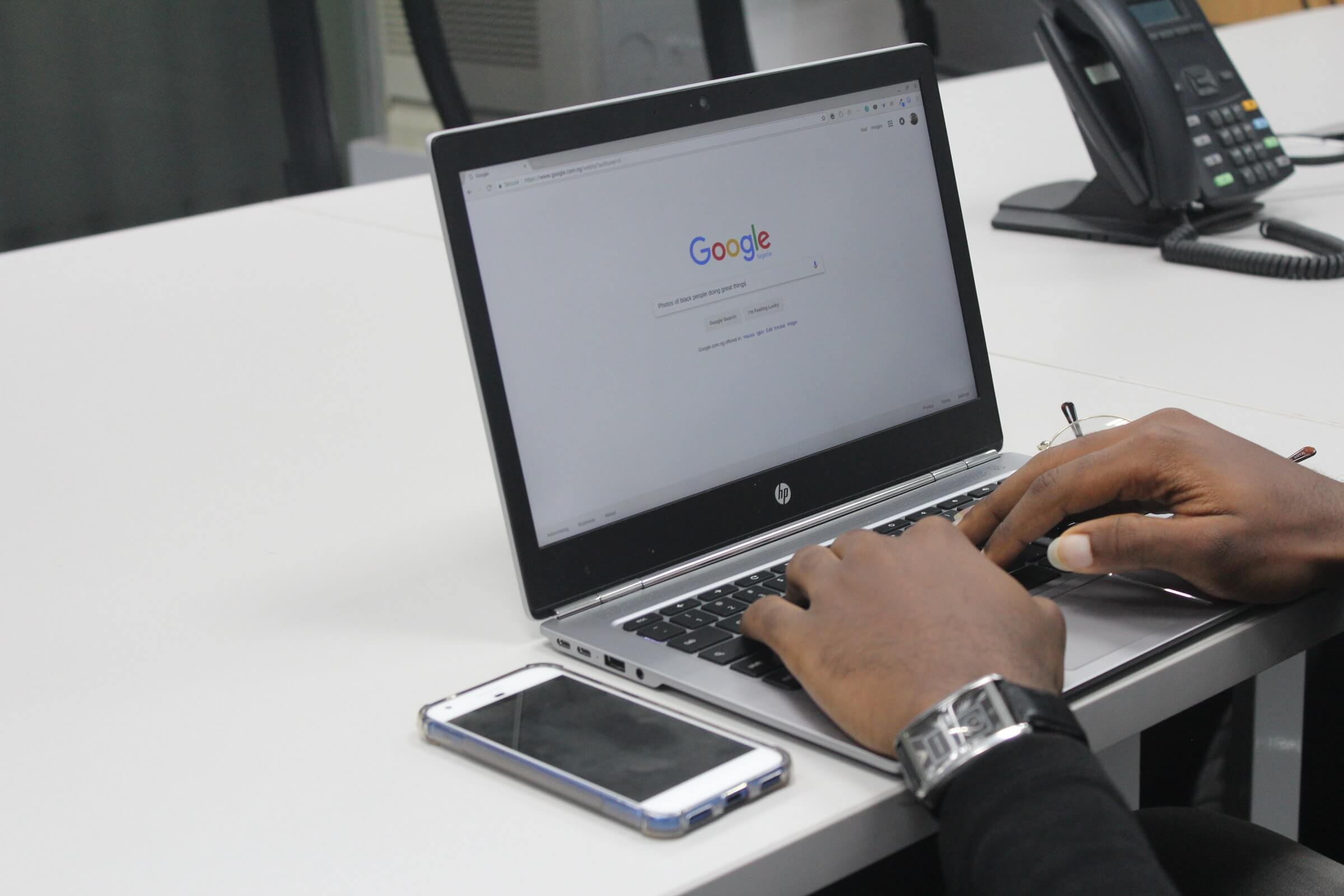 A man using his laptop to apply for a google ad grant