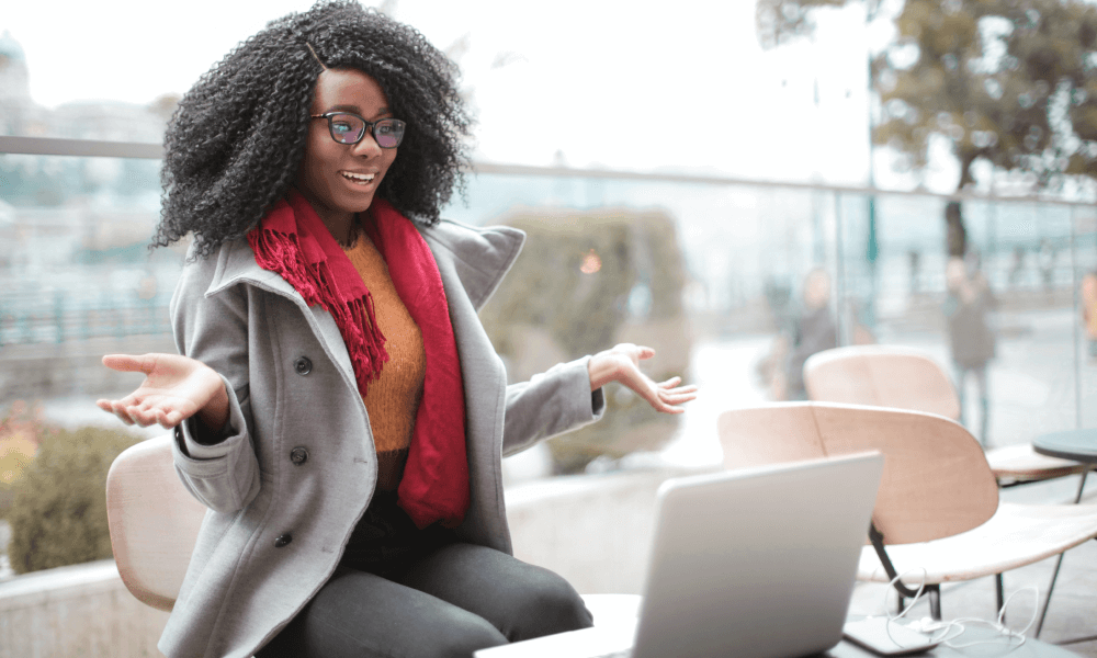 Cheerful black woman in an online fundraising event