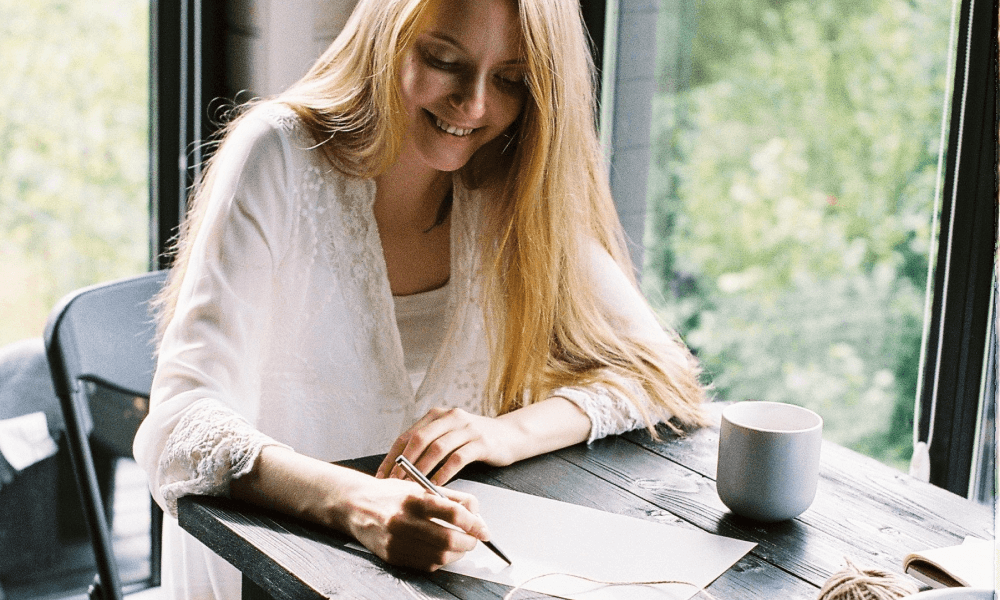 Young lady writing a donation letter request