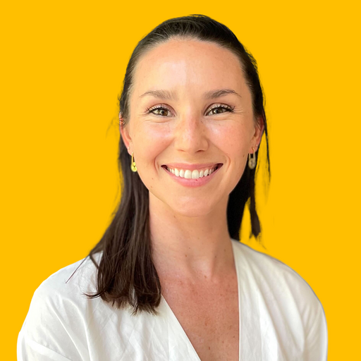 Hannah's headshot against a yellow background